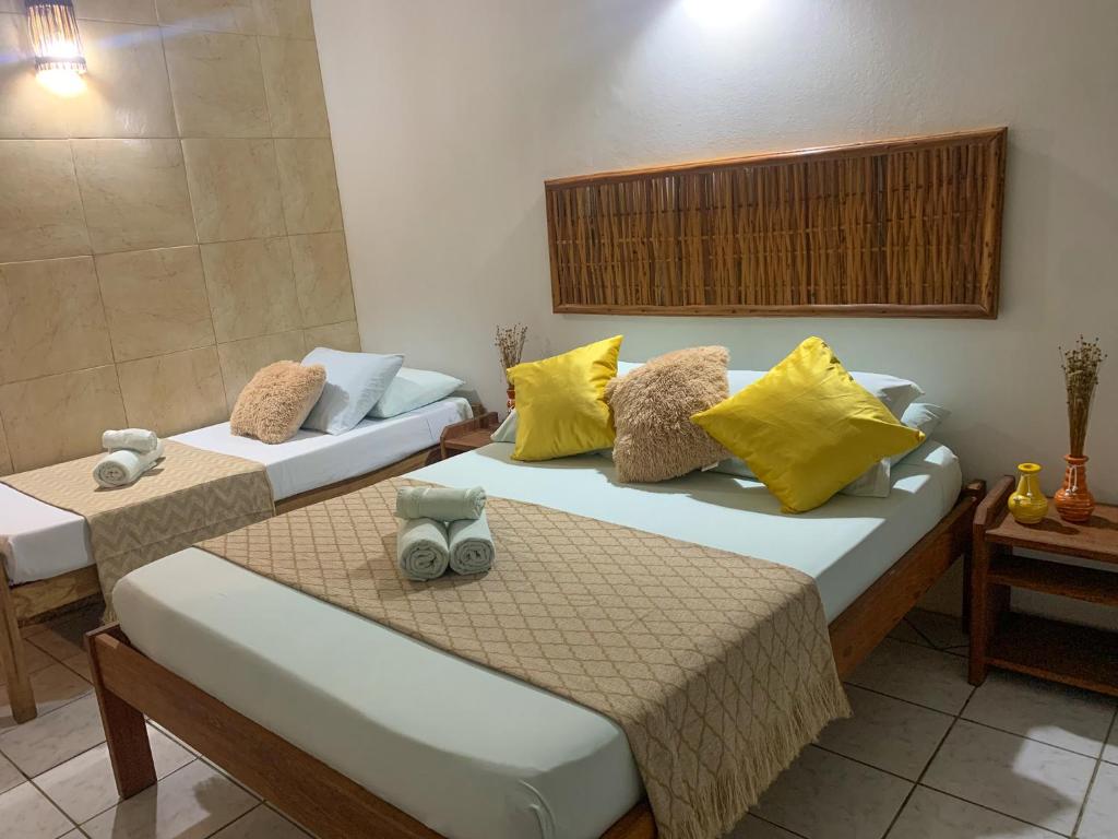 Cama ou camas em um quarto em Pousada Lanai