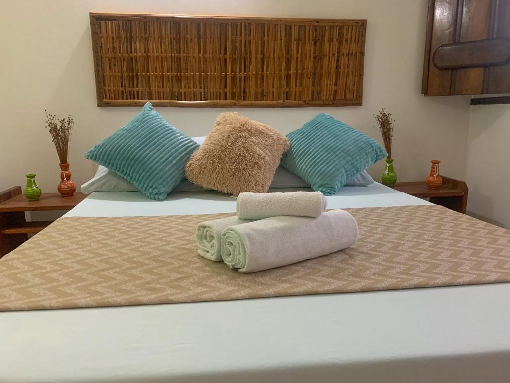 Cama ou camas em um quarto em Pousada Lanai