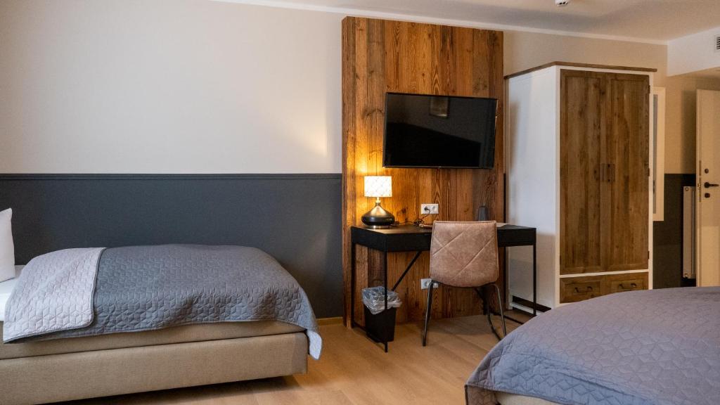 Postel nebo postele na pokoji v ubytování Altstadt-Hotel