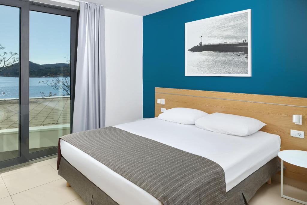 Posteľ alebo postele v izbe v ubytovaní Maistra Select Mlini Villas and Apartments