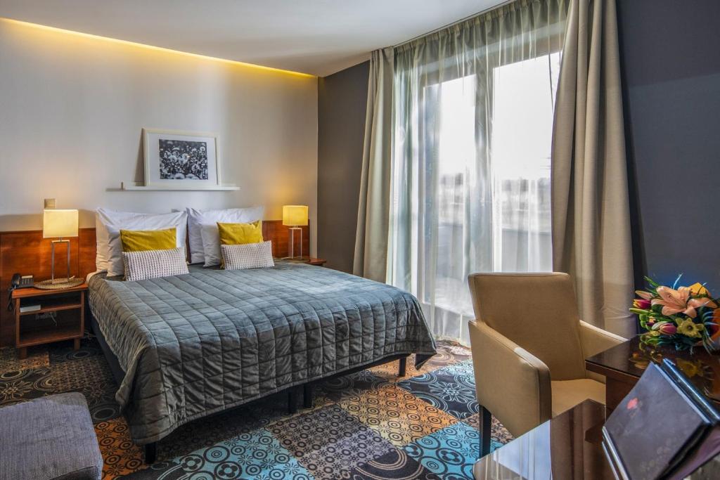 Postel nebo postele na pokoji v ubytování Budapest Airport Hotel Stáció Wellness & Konferencia