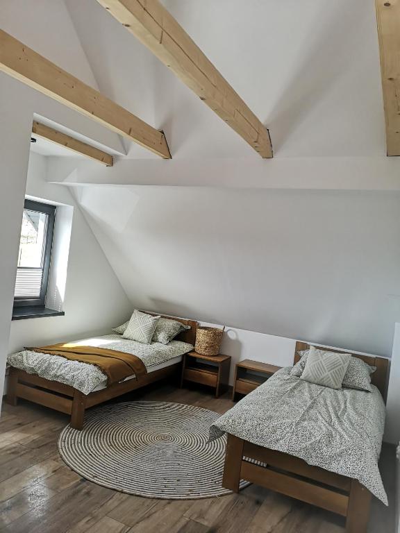 Postel nebo postele na pokoji v ubytování Cozy mountain house - Coolówka pod Babią Górą