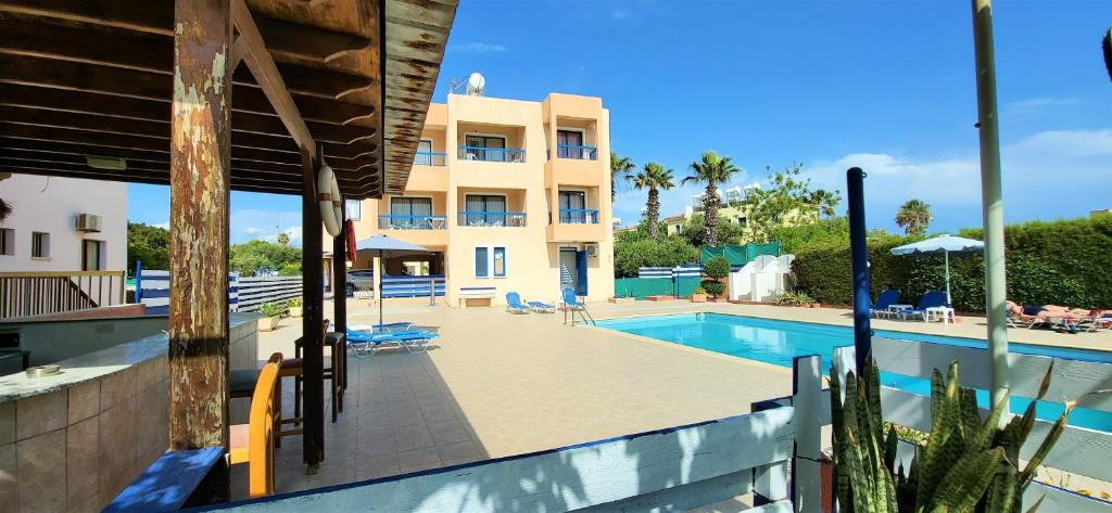 a view of the swimming pool at a resort at Georgia Apartments in Paphos