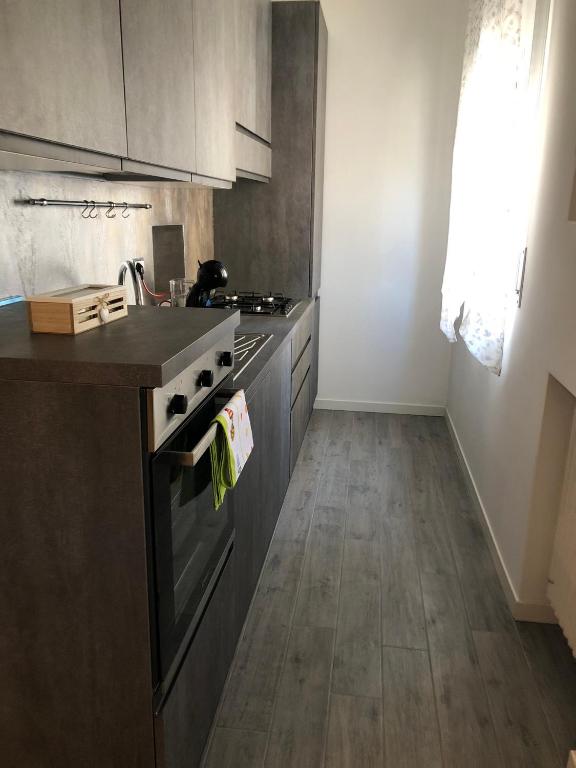 Kuchyňa alebo kuchynka v ubytovaní SweetHome