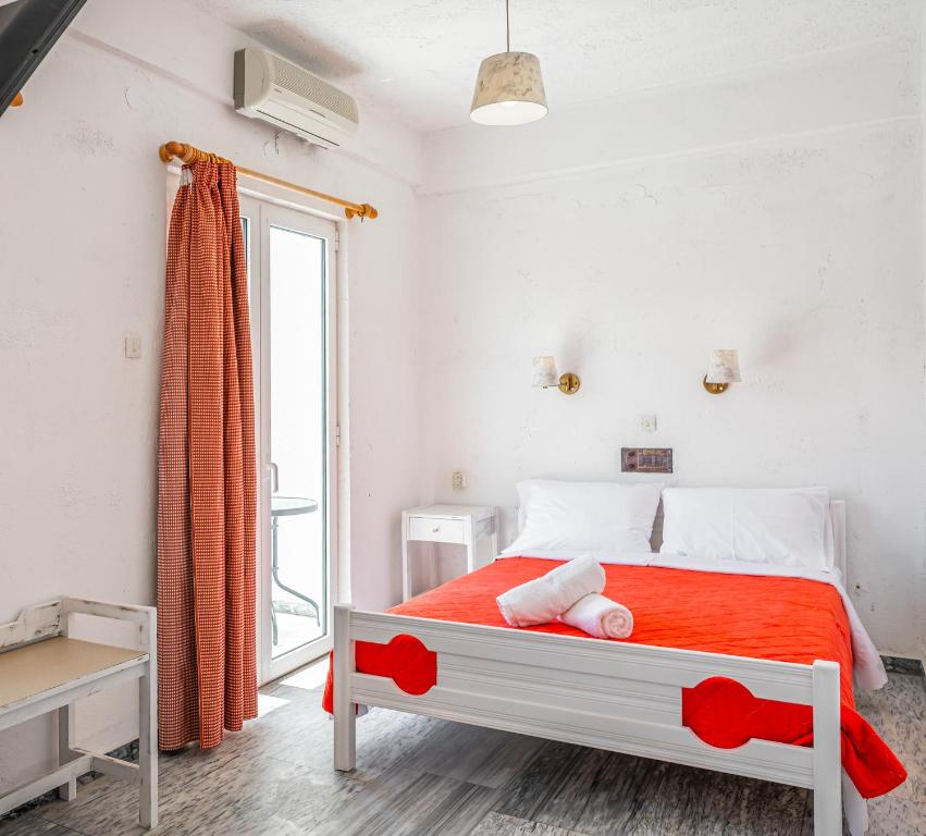 Postel nebo postele na pokoji v ubytování Matala Hostel