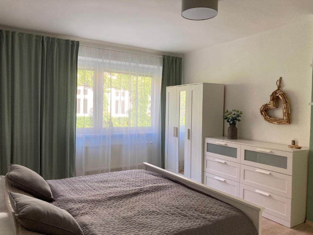 Postel nebo postele na pokoji v ubytování Family Provence Mikulov