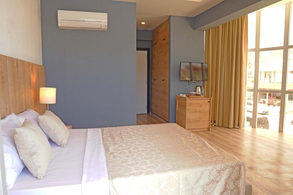 Postel nebo postele na pokoji v ubytování Hotel Felizya Kemer