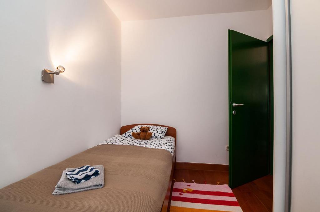 Posteľ alebo postele v izbe v ubytovaní Lara&Dan apartments