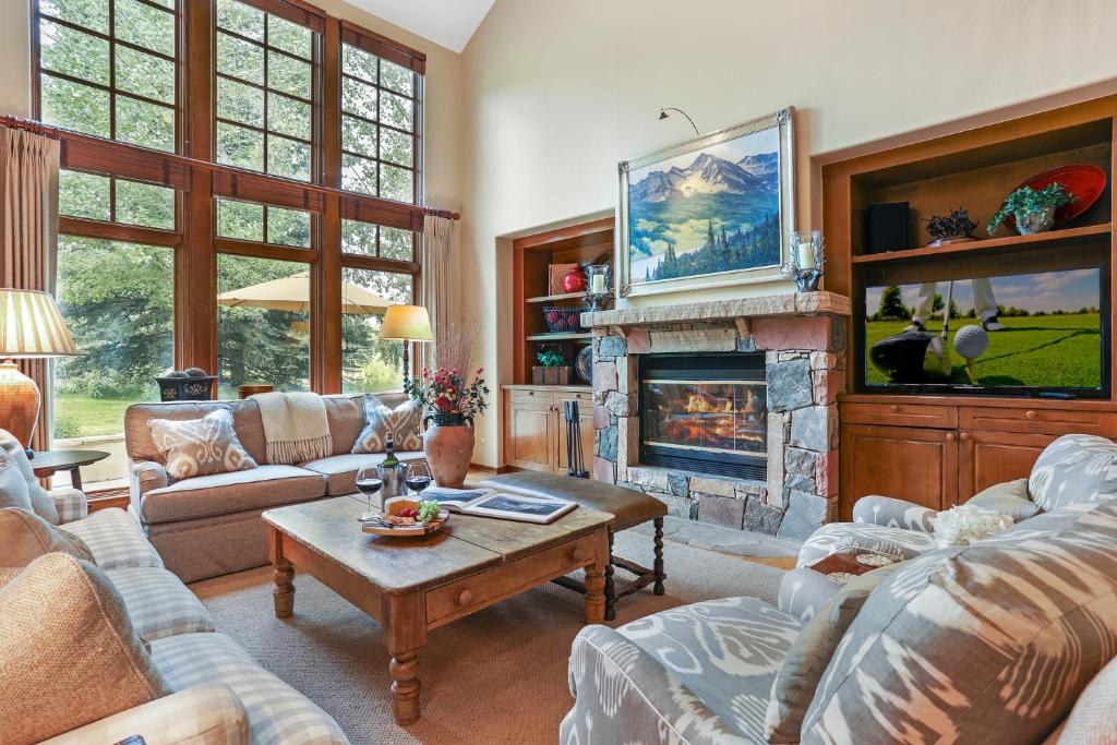 a living room with couches and a fireplace at 143 Enclave in Avon