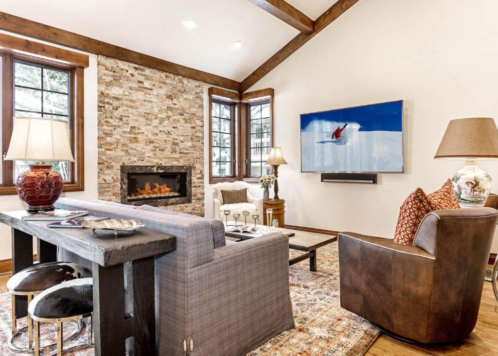 a living room with a couch and a fireplace at 6 Wildflower in Edwards
