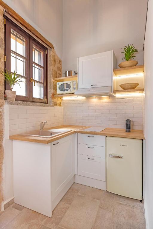 Kuchyň nebo kuchyňský kout v ubytování Sala Historical Luxury Suites