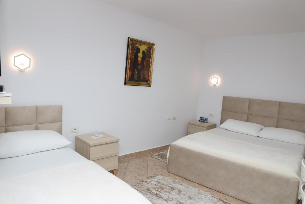 Postel nebo postele na pokoji v ubytování Downtown Apartment 2