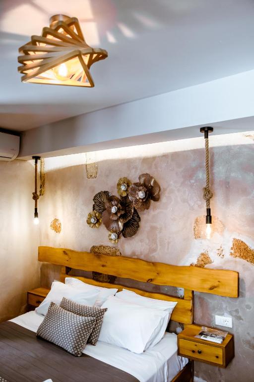 Postel nebo postele na pokoji v ubytování Bozzali Deluxe Hotel