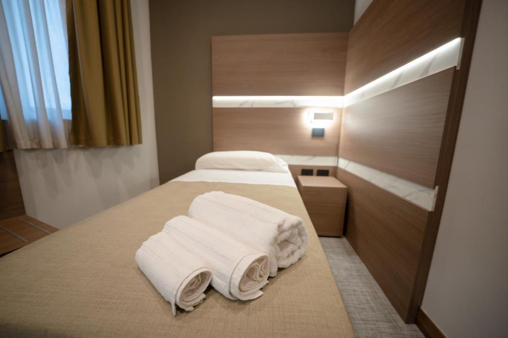 Postel nebo postele na pokoji v ubytování Building Hotel