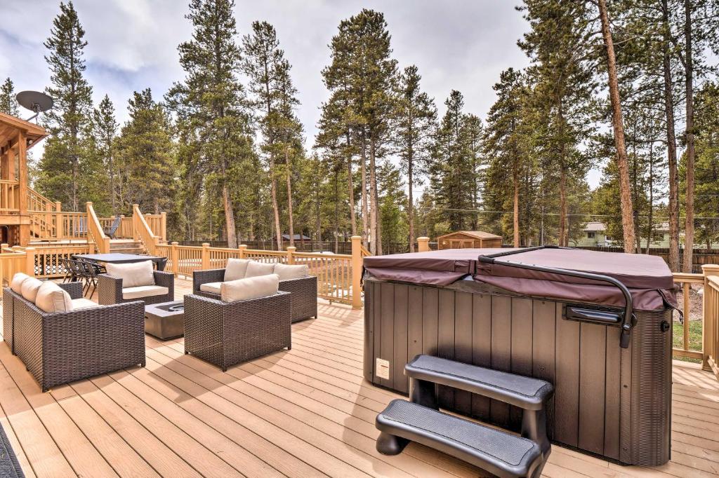 a deck with chairs and a gazebo at Luxury Leadville Getaway with Hot Tub! in Leadville