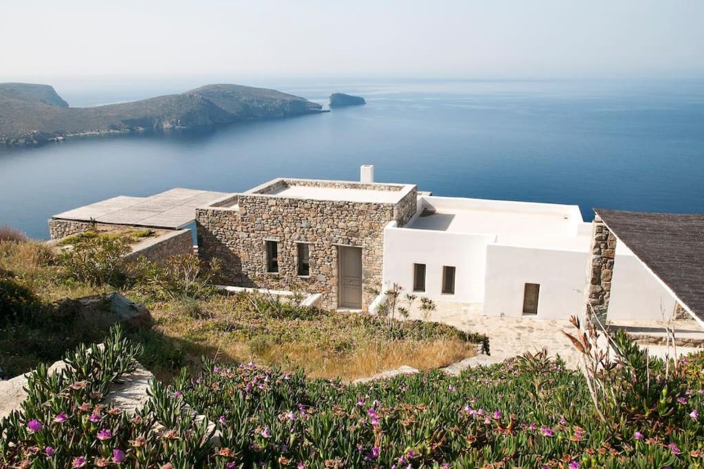 a house on a hill with a view of the water at Dreamy Cycladic Luxury Summer Villa 1 in Serifos Chora