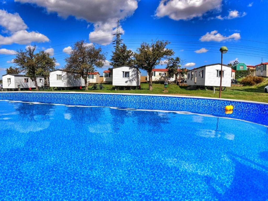 a swimming pool with houses in the background at Holiday Home Prima Plus by Interhome in Prague