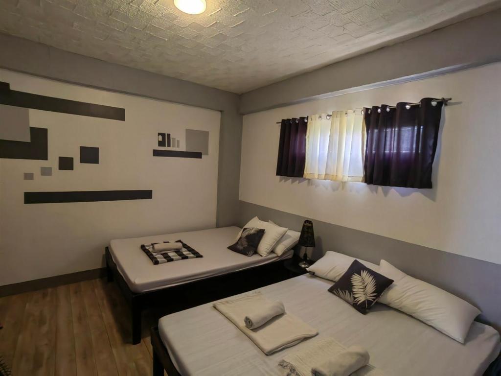 Postel nebo postele na pokoji v ubytování AA TRAVELLERS PAD