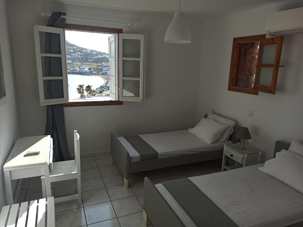 Posteľ alebo postele v izbe v ubytovaní Revel Mykonos 6
