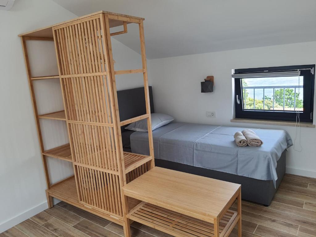 Postel nebo postele na pokoji v ubytování Apartments Krista Medveja