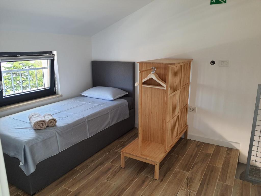 Postel nebo postele na pokoji v ubytování Apartments Krista Medveja
