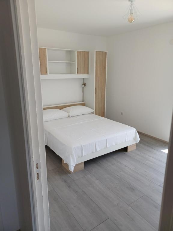 Posteľ alebo postele v izbe v ubytovaní APARTMANI JELIĆ