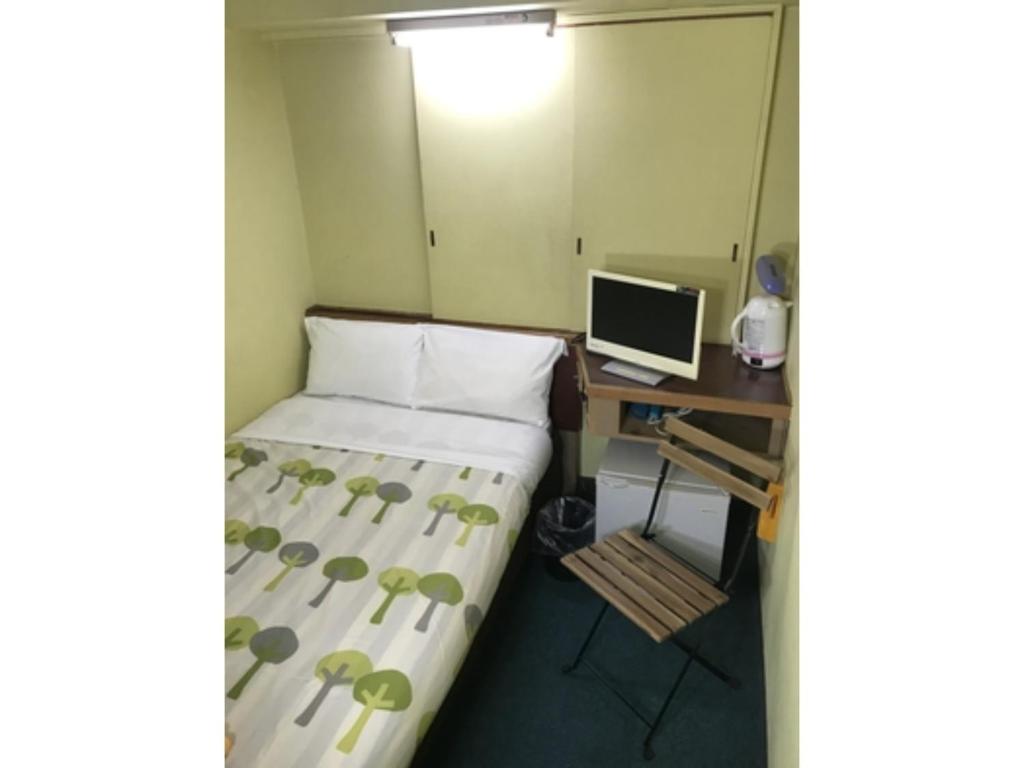 Säng eller sängar i ett rum på Rico Hotel Kokura - Vacation STAY 22587v