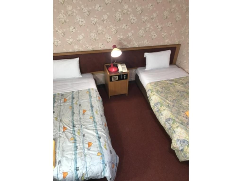 Ein Bett oder Betten in einem Zimmer der Unterkunft Rico Hotel Kokura - Vacation STAY 22596v