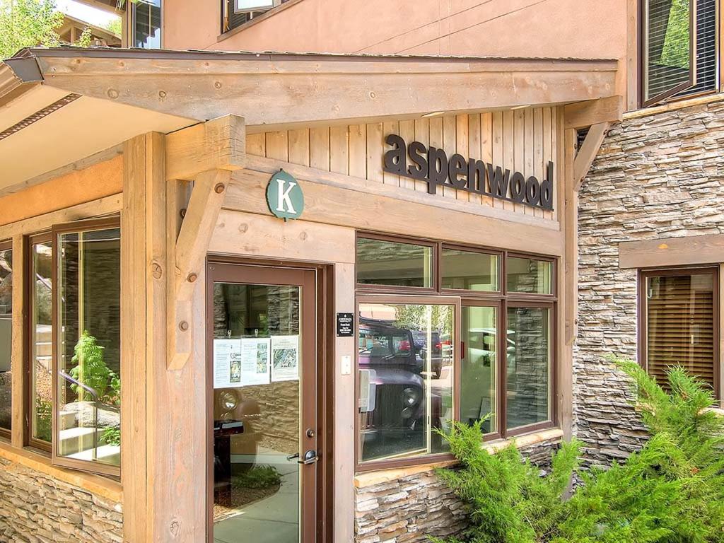 a store with a sign on the front of a building at Aspenwood by Snowmass Vacations in Snowmass Village