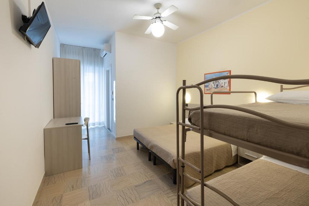 Postel nebo postele na pokoji v ubytování Hotel Giordo