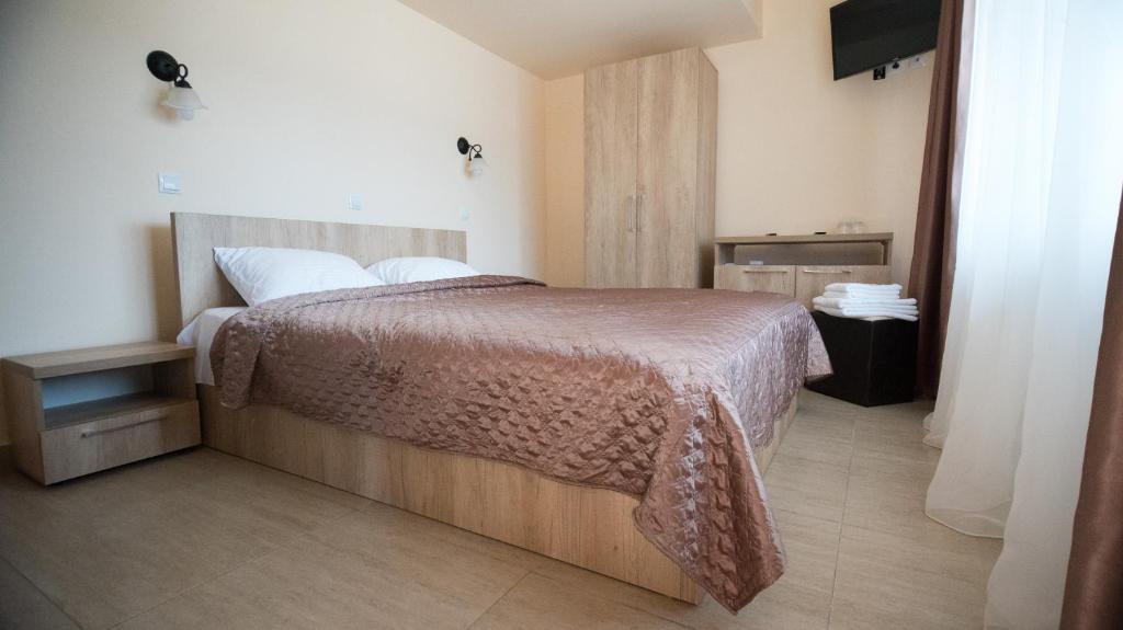 Postel nebo postele na pokoji v ubytování MELBA 3 flori cazanele Dunarii