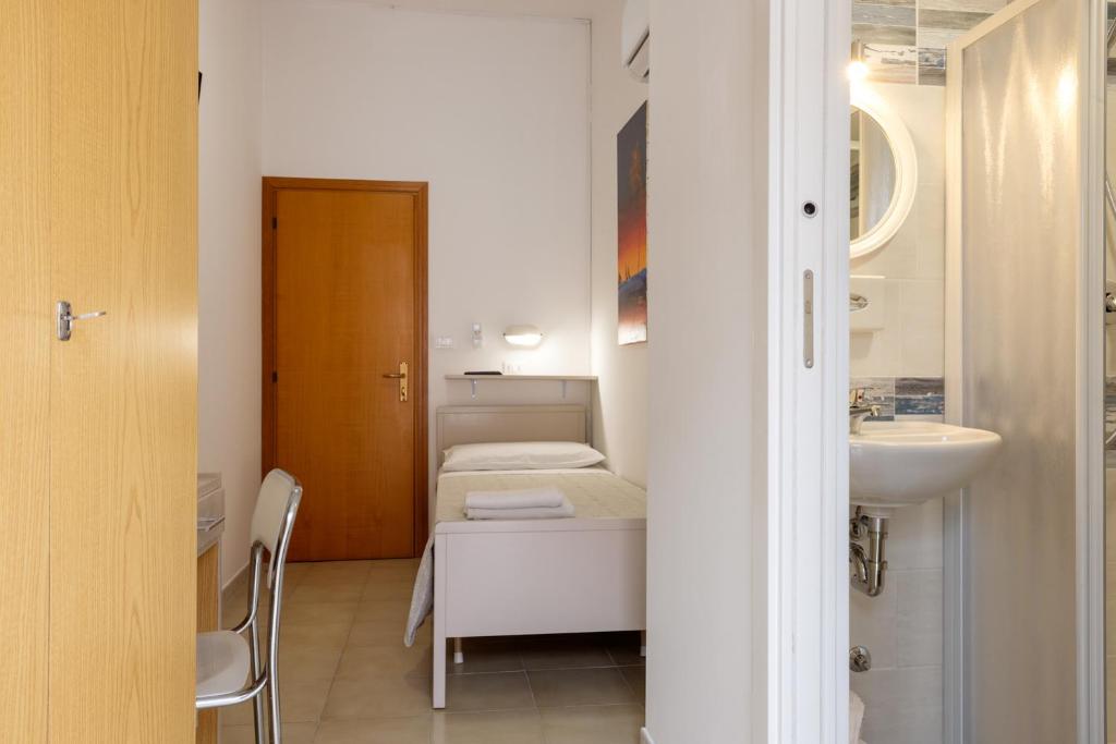 Postel nebo postele na pokoji v ubytování Hotel Giordo