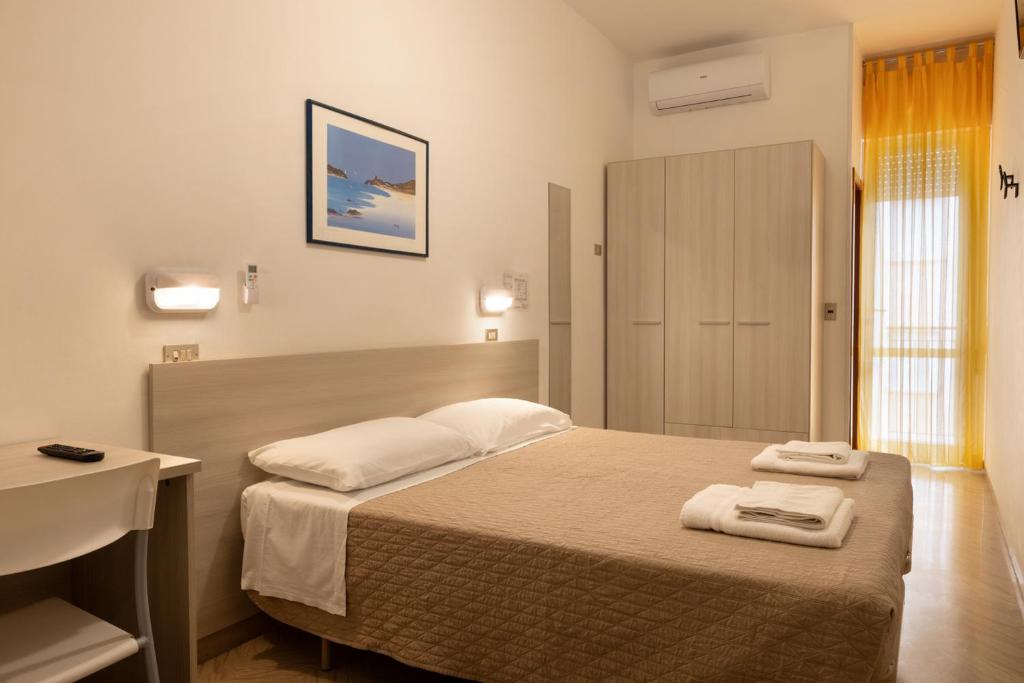Postel nebo postele na pokoji v ubytování Hotel Giordo