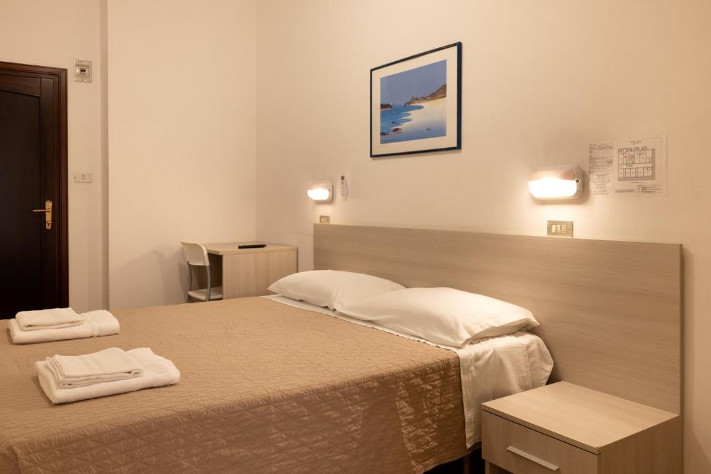 Postel nebo postele na pokoji v ubytování Hotel Giordo