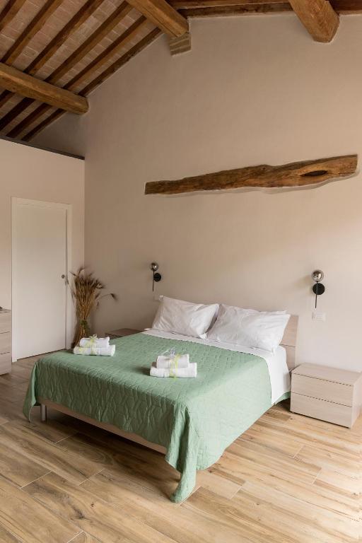 Postel nebo postele na pokoji v ubytování Agriturismo L'Aquilone