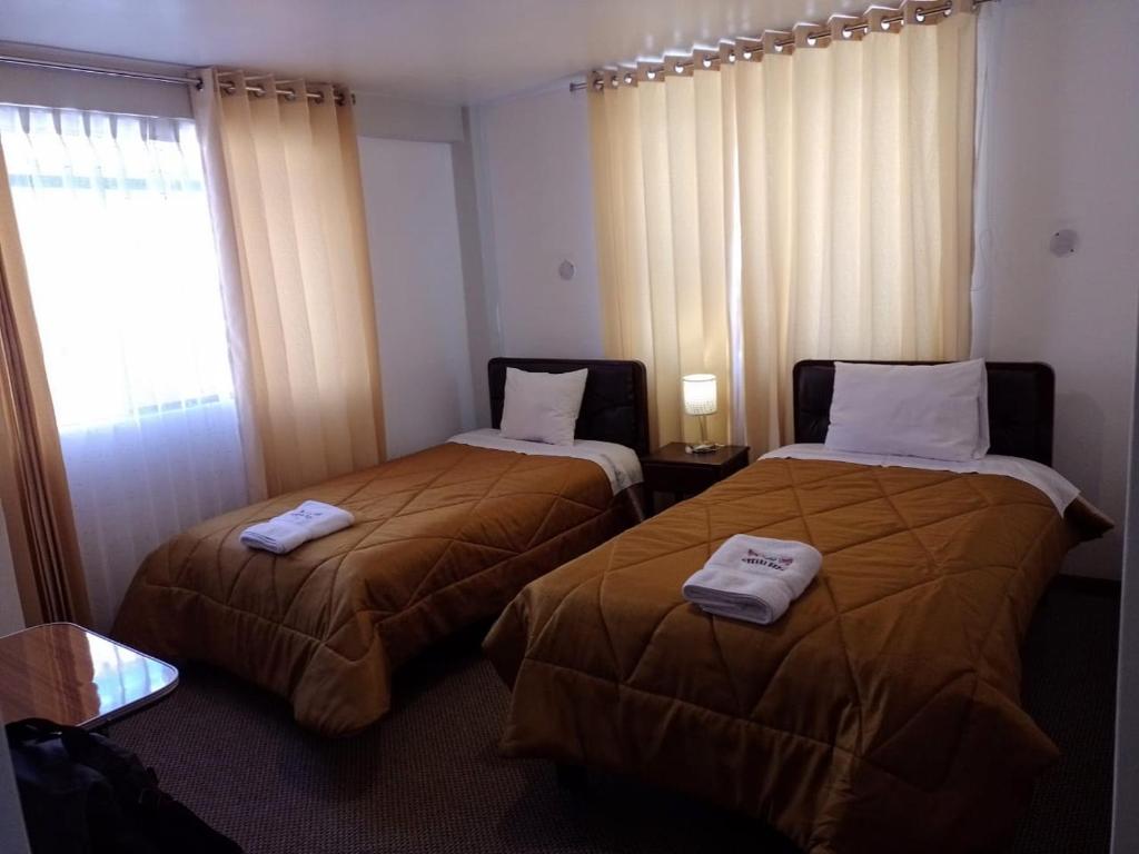 Postel nebo postele na pokoji v ubytování Pukara House