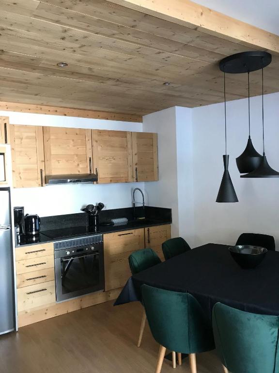 Kuchyň nebo kuchyňský kout v ubytování Cocoonabay Appartements