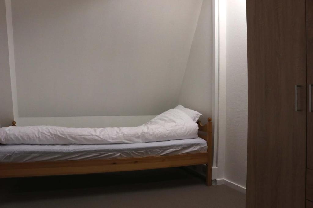 Voodi või voodid majutusasutuse Budget Rooms Copenhagen toas