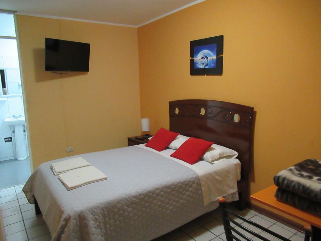 Postel nebo postele na pokoji v ubytování Kurmi Hostel Lima Airport