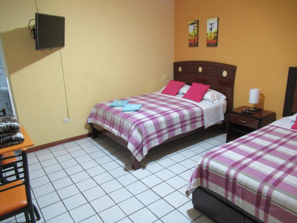 Postel nebo postele na pokoji v ubytování Kurmi Hostel Lima Airport