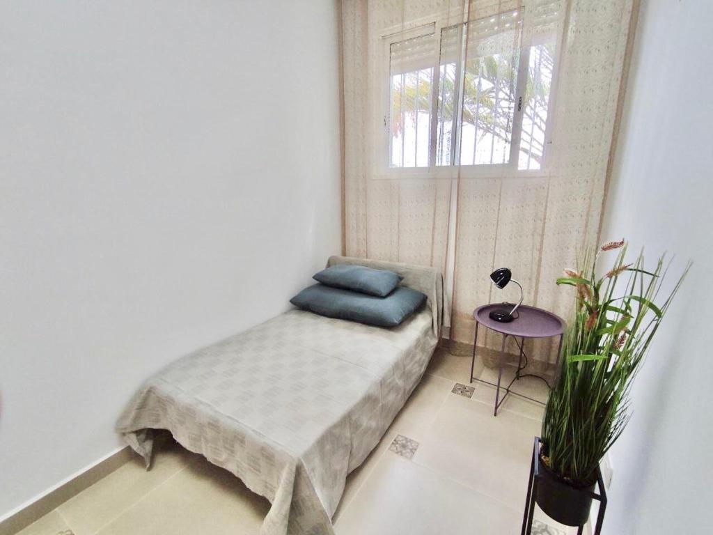 A bed or beds in a room at Bungaló Santa Ana