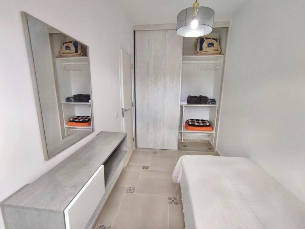 A bed or beds in a room at Bungaló Santa Ana