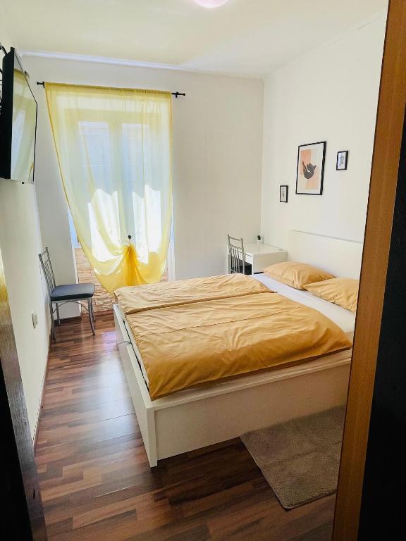 Posteľ alebo postele v izbe v ubytovaní Apartman Three Queens