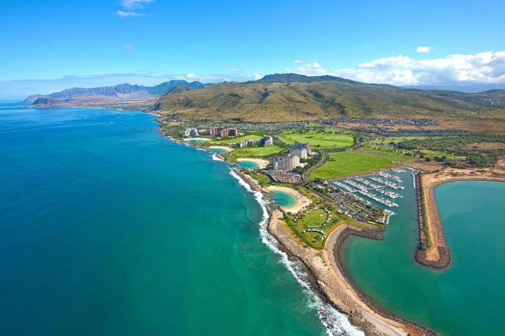 an aerial view of a beach and the ocean at Luxury Ko Olina 2 story resort villa - 5 minutes walk to the beach! in Kapolei