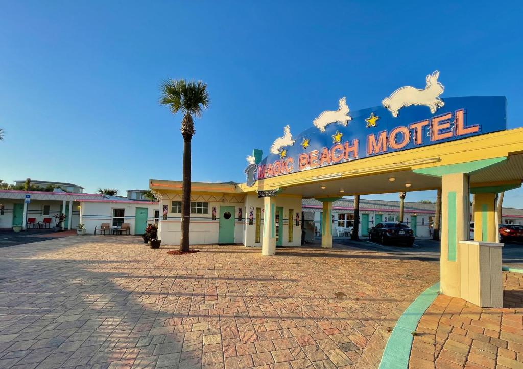 a hotel with a sign that reads the beach motel at Magic Beach Motel - Vilano Beach, Saint Augustine in Saint Augustine