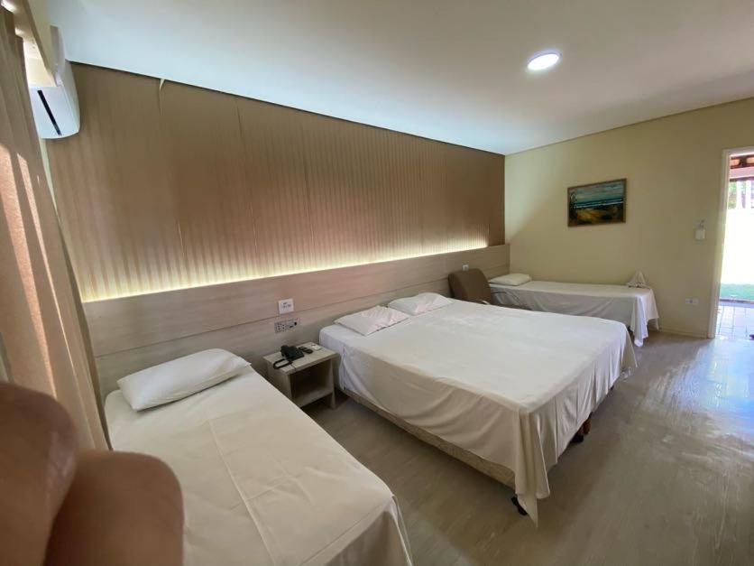 Llit o llits en una habitació de Campo Belo Resort