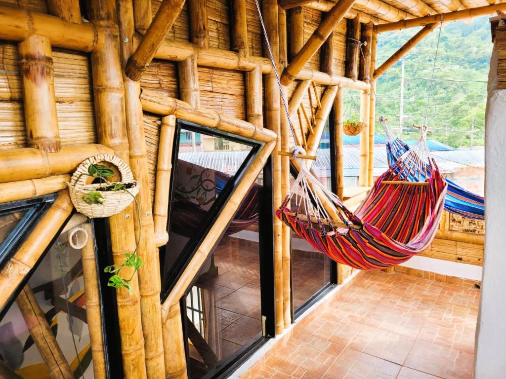 a room with two hammocks in a log cabin at Casa Passaro 3 in Córdoba