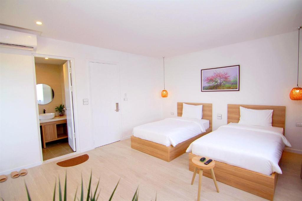 Postelja oz. postelje v sobi nastanitve Haradise Suite Villa & Homestay Ha Long