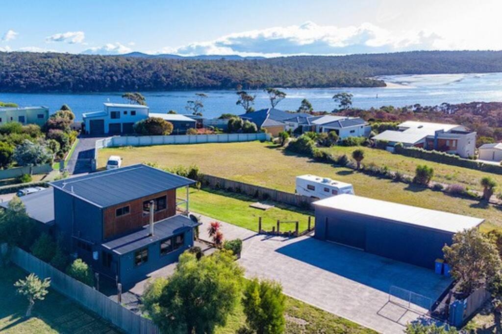an aerial view of a house with a large yard at Top Of The Bay-Modern Home With Spectacular Views in St Helens
