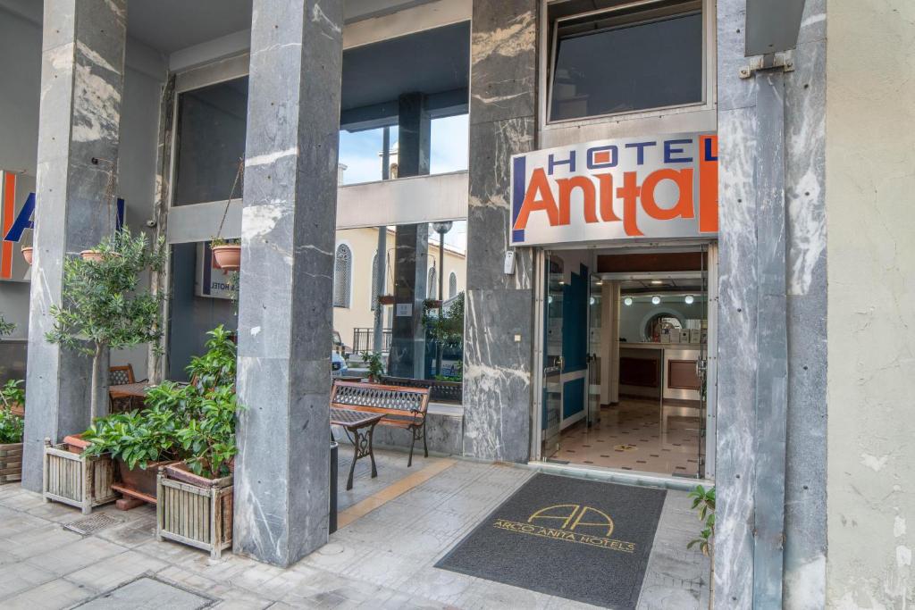 
a building with a sign on the front of it at Anita Hotel in Piraeus
